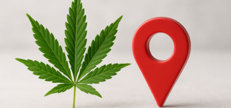 A green cannabis leaf next to a red location pin symbol on a light background.