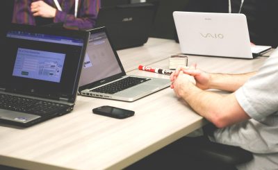 Laptops, meeting, businessmen — Bree Montoya: Leading With Integrity, Expertise, and Accountability