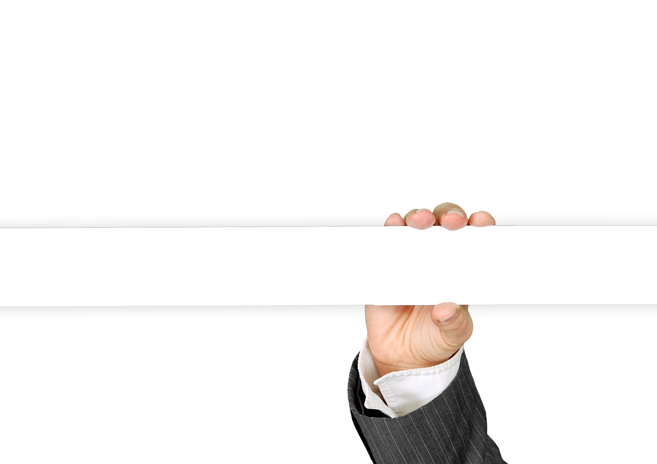 Hand, business card, keep — Everything You Need to Know About Medicare is on MedicarePlansGuide.org